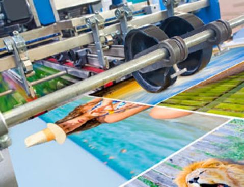 Offset machine printing a colored poster